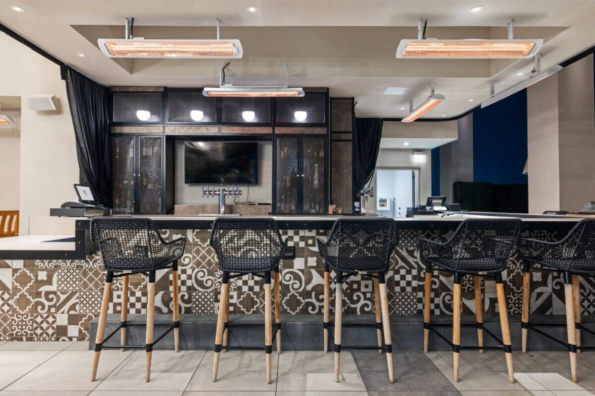 White Bromic Tungsten patio heaters at terrace area